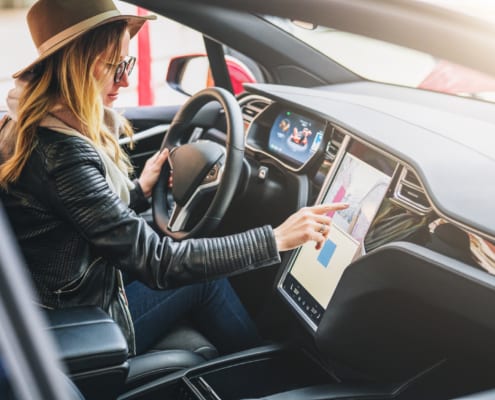 woman driving Tesla