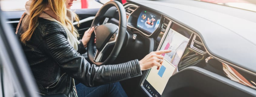 woman driving Tesla